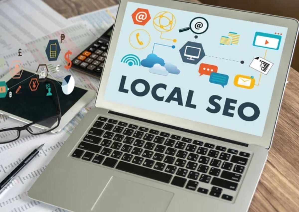 Photo of an open laptop displaying, "Local SEO" for Google Business Profile Optimization