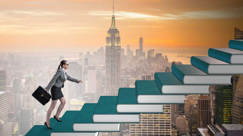 Simply The Best Digital Marketing Boca Raton image of a woman climbing the ladder made of blue books with a city backdrop